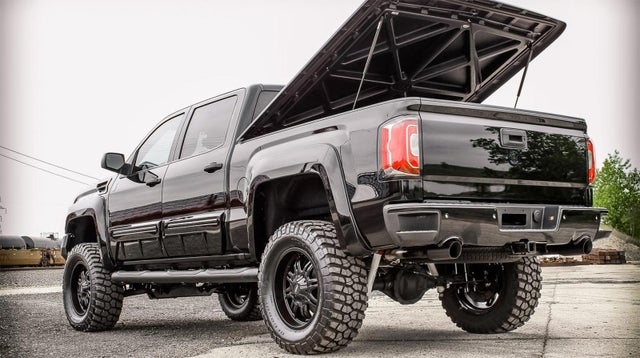 GMC Black Ops - By Tuscany Truck with Tonneau Cover opened