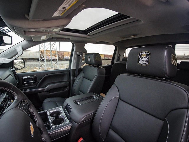 GMC Black Ops - By Tuscany Truck with Tonneau Cover opened